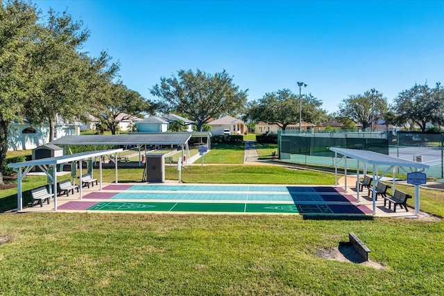 view of property's community featuring a lawn