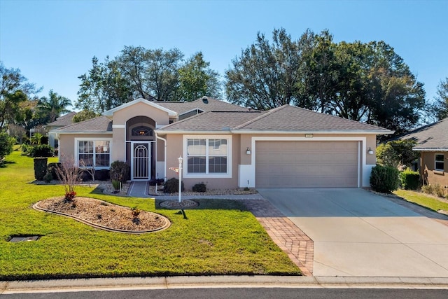 ranch-style home with a front yard and a garage