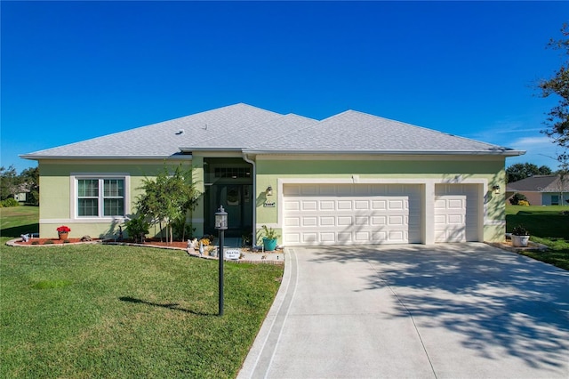 single story home featuring a garage and a front lawn