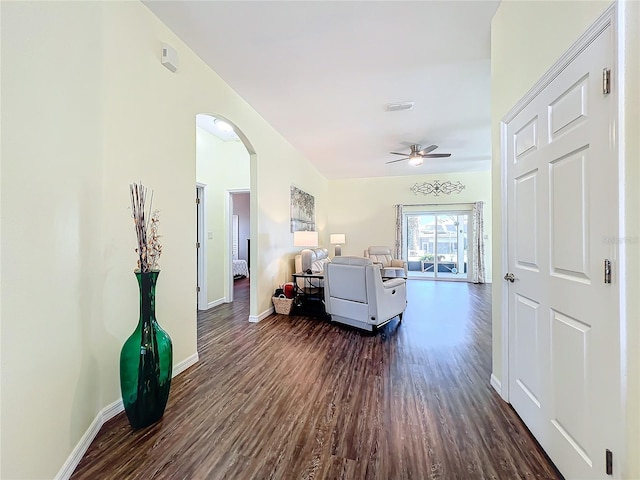 hallway with dark hardwood / wood-style flooring