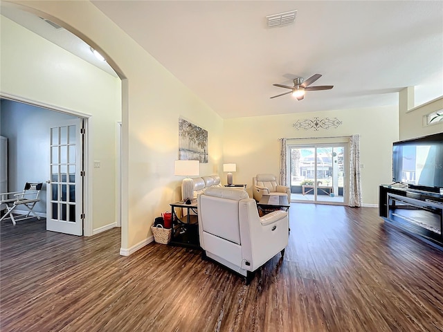 living room featuring dark hardwood / wood-style floors and ceiling fan