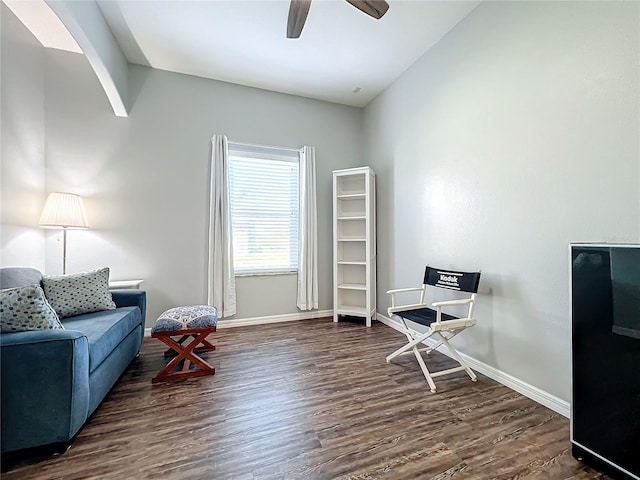 sitting room featuring lofted ceiling, ceiling fan, and dark hardwood / wood-style floors