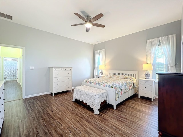 bedroom featuring ceiling fan and dark wood-type flooring