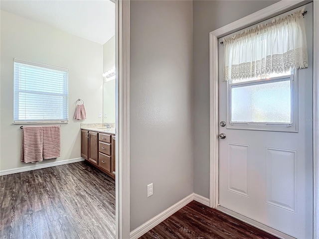 entryway with dark wood-type flooring