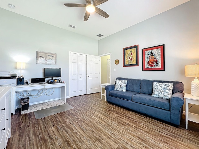 living room featuring hardwood / wood-style floors and ceiling fan