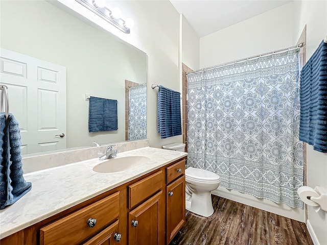 bathroom featuring hardwood / wood-style floors, vanity, and toilet