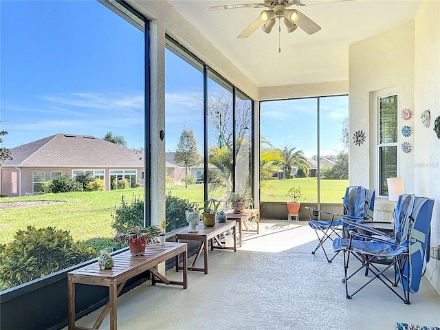 sunroom / solarium with ceiling fan