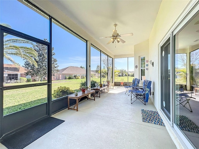 sunroom featuring a wealth of natural light and ceiling fan