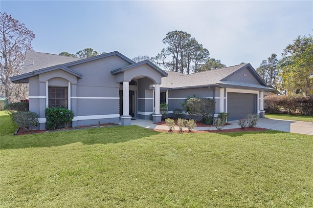 ranch-style house with a garage and a front lawn