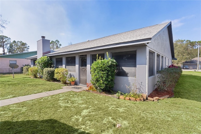 ranch-style home with a front yard