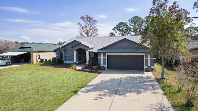 ranch-style home featuring a garage and a front lawn