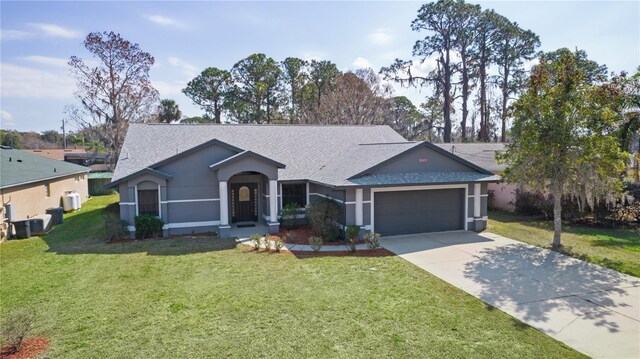 single story home featuring a garage and a front yard