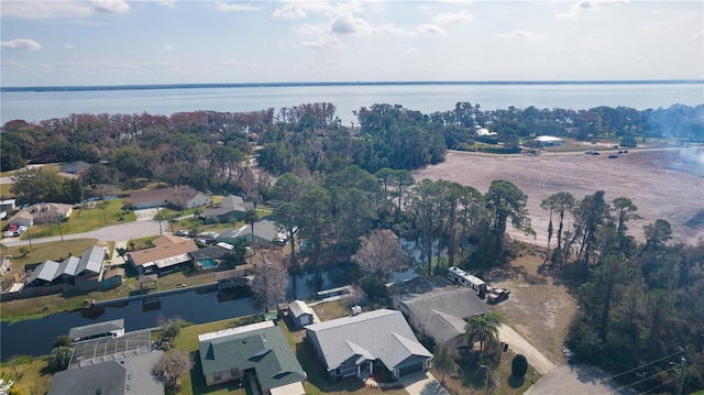 drone / aerial view with a water view