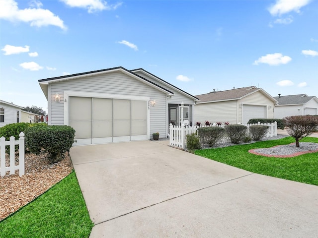 ranch-style house with a front yard and a garage