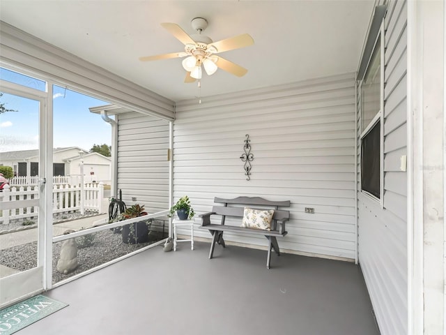 sunroom / solarium with ceiling fan