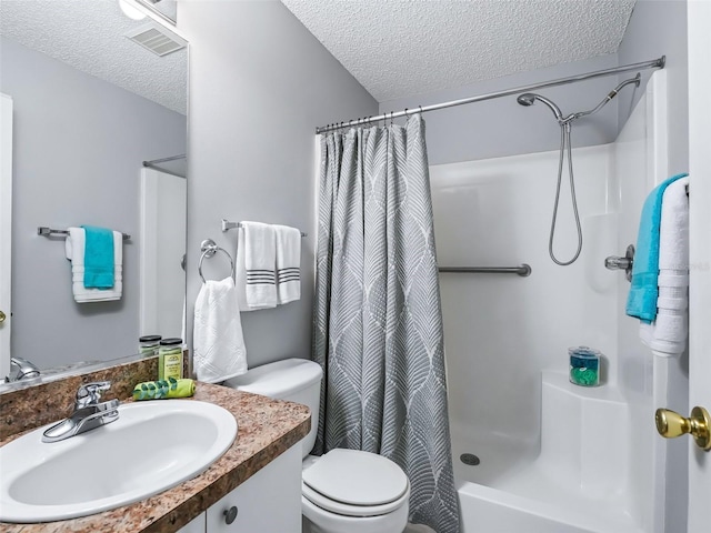 bathroom featuring a textured ceiling, toilet, vanity, and a shower with shower curtain