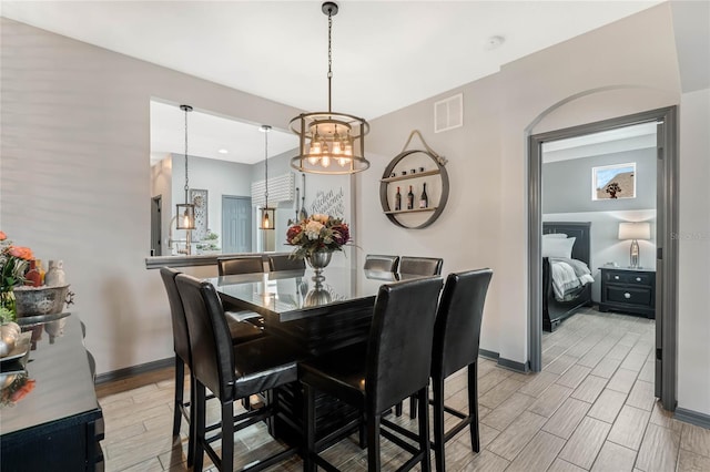 dining room with a notable chandelier