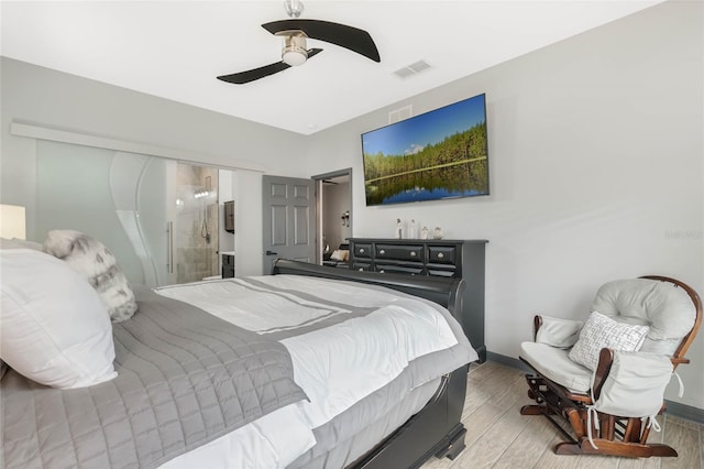 bedroom with ceiling fan and light hardwood / wood-style flooring