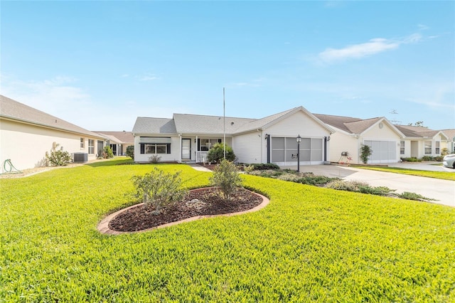 single story home with cooling unit, a garage, and a front yard