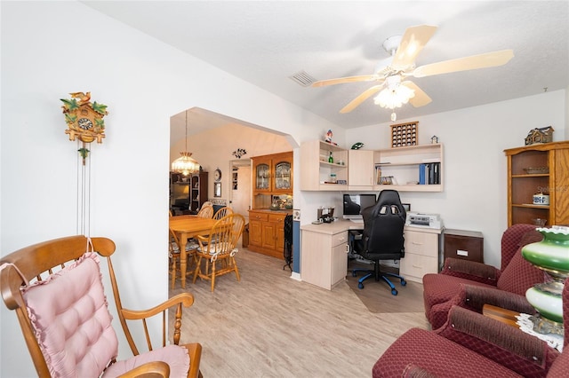 home office featuring ceiling fan and light hardwood / wood-style flooring