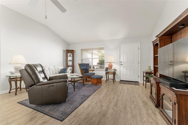 1904 De Hoyos Pl, The Villages, FL 32159 - living area featuring light wood-style flooring, baseboards, vaulted ceiling, and a ceiling fan