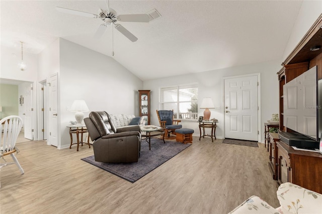 1904 De Hoyos Pl, The Villages, FL 32159 - living area featuring light wood-style flooring, baseboards, a ceiling fan, and vaulted ceiling