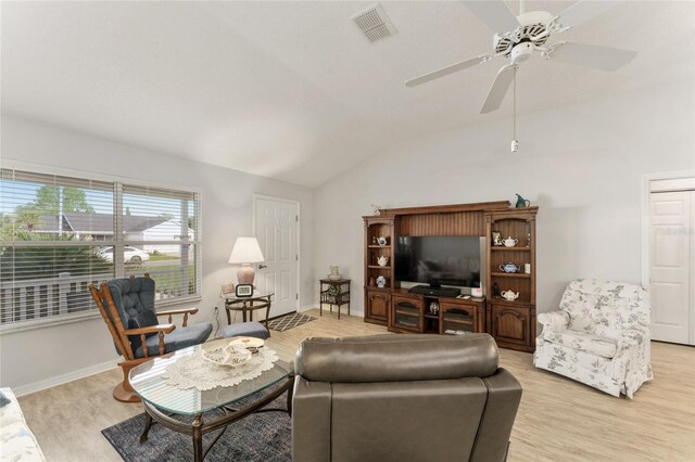 1904 De Hoyos Pl, The Villages, FL 32159 - living room featuring light wood-style floors, ceiling fan, vaulted ceiling, visible vents, and baseboards