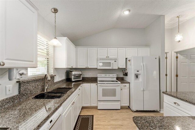 1904 De Hoyos Pl, The Villages, FL 32159 - kitchen with a sink, white appliances, and white cabinets