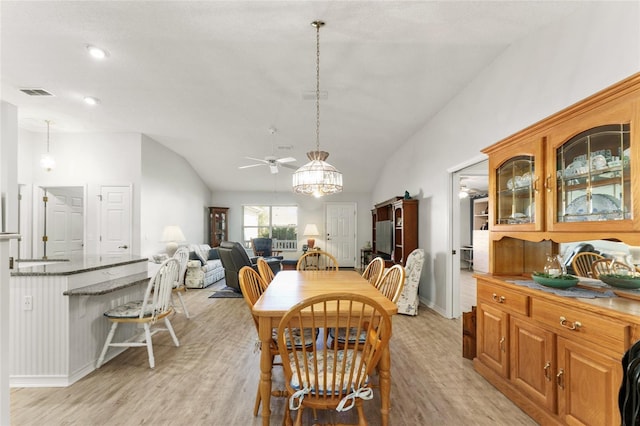 1904 De Hoyos Pl, The Villages, FL 32159 - dining room featuring lofted ceiling, light wood-type flooring, and ceiling fan