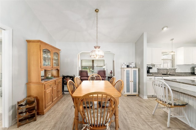 1904 De Hoyos Pl, The Villages, FL 32159 - dining space with light wood-style flooring, a chandelier, lofted ceiling, and plenty of natural light