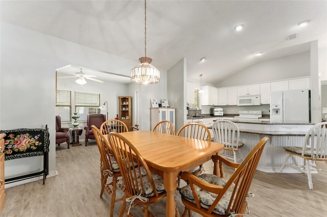 1904 De Hoyos Pl, The Villages, FL 32159 - dining room with light wood-style floors, ceiling fan with notable chandelier, visible vents, and lofted ceiling