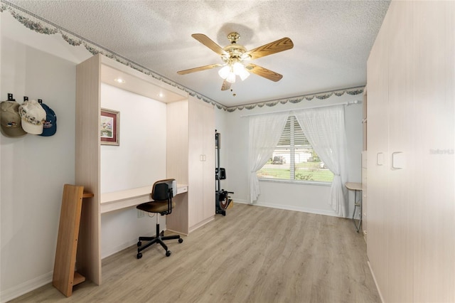 1904 De Hoyos Pl, The Villages, FL 32159 - interior space with light wood-type flooring, baseboards, a ceiling fan, and a textured ceiling
