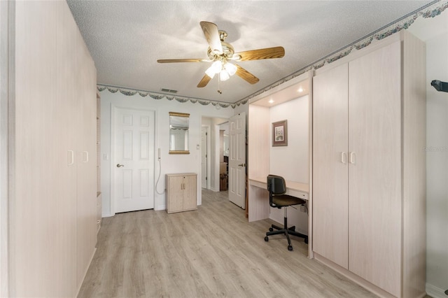1904 De Hoyos Pl, The Villages, FL 32159 - office with light wood-style flooring, a textured ceiling, ceiling fan, and visible vents