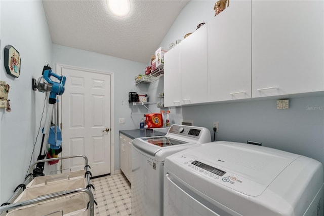 1904 De Hoyos Pl, The Villages, FL 32159 - laundry room with washer and dryer, a textured ceiling, light floors, and cabinet space
