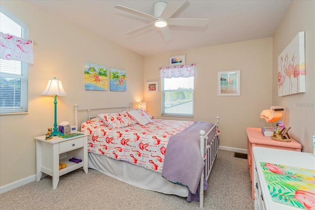 carpeted bedroom featuring ceiling fan