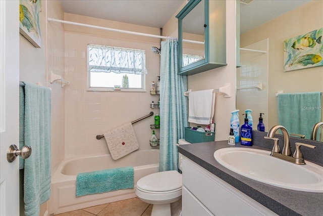 full bathroom with shower / tub combo, vanity, tile patterned flooring, and toilet