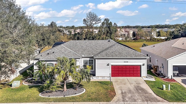 single story home with cooling unit, a front yard, and a garage