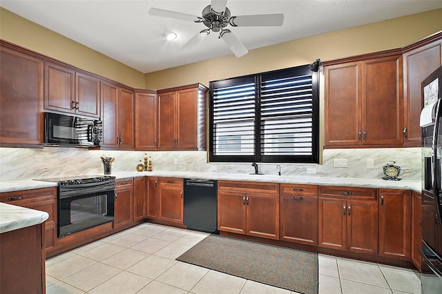 kitchen featuring black appliances, sink, ceiling fan, light tile patterned floors, and tasteful backsplash