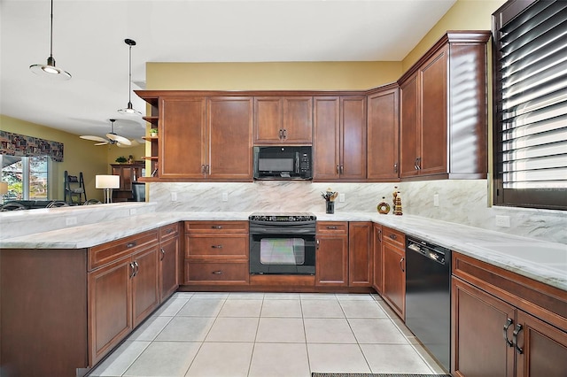 kitchen featuring black appliances, kitchen peninsula, hanging light fixtures, and tasteful backsplash