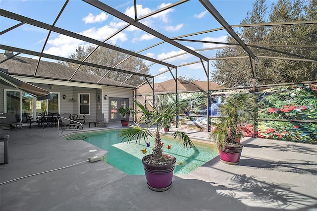 view of pool with a lanai, a patio area, and ceiling fan