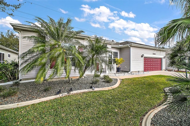 view of front of property with a garage and a front lawn