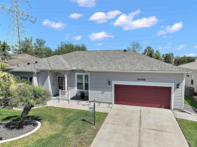 3839 Manor Oaks Ct, Leesburg, FL 34748 - ranch-style house featuring concrete driveway, roof with shingles, an attached garage, a front yard, and central AC