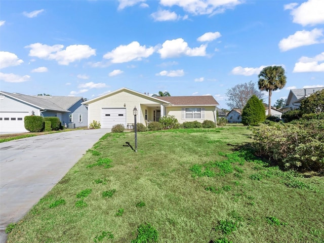 single story home with a front yard and a garage