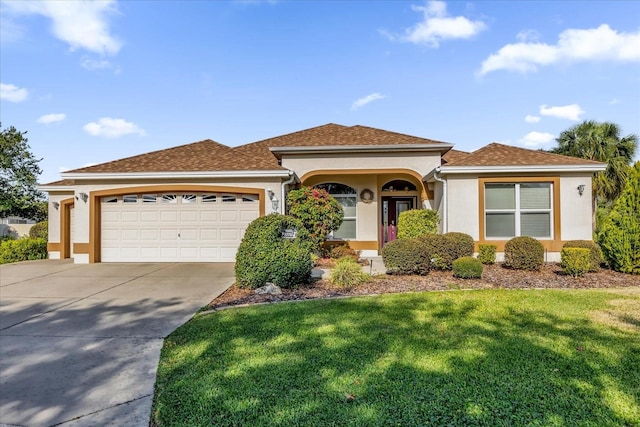 view of front of house with a garage and a front lawn