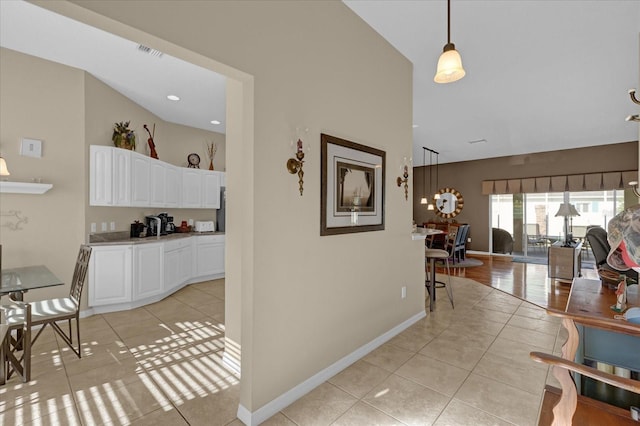 hallway with light tile patterned floors