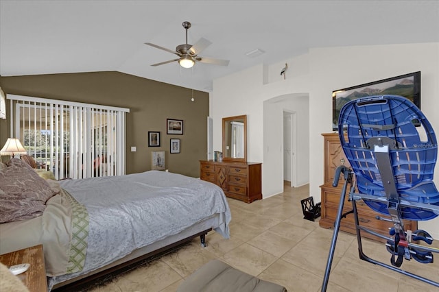 tiled bedroom featuring ceiling fan and vaulted ceiling