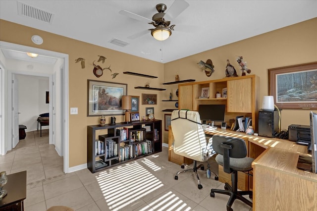 tiled office space featuring ceiling fan