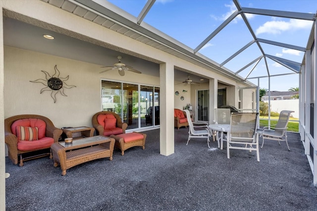 view of patio / terrace featuring ceiling fan and a lanai