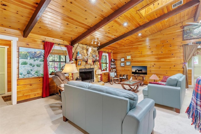 living room featuring light carpet, lofted ceiling with skylight, wooden walls, and wood ceiling