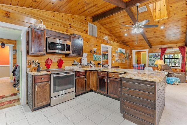 kitchen featuring kitchen peninsula, wooden walls, light tile patterned flooring, wood ceiling, and stainless steel appliances